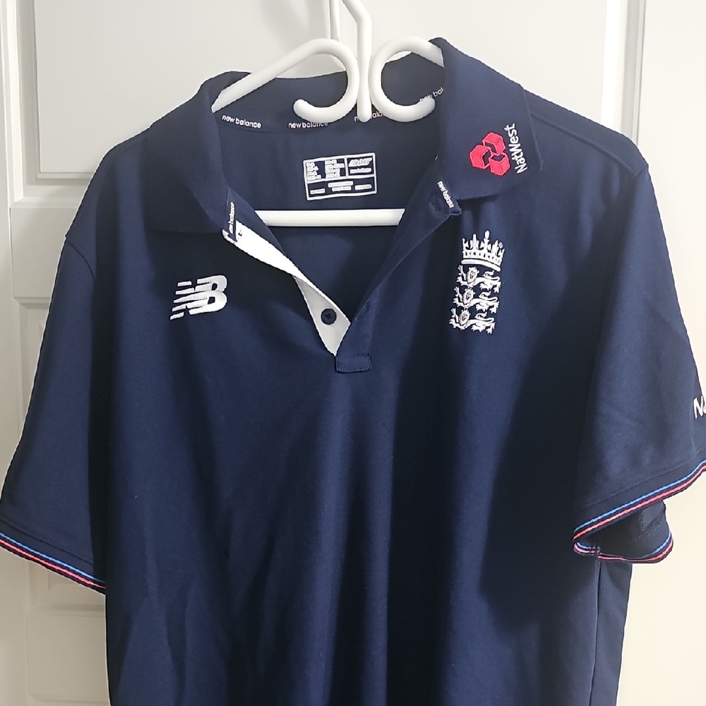 New Balance Dark Blue Polo with Embroidered Details